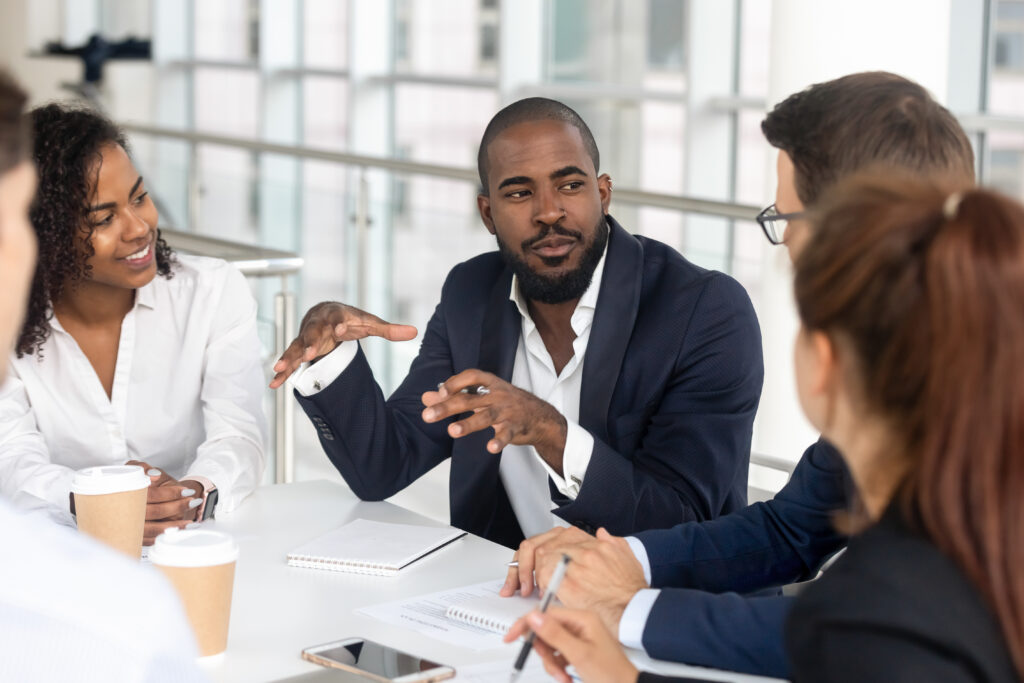 Millennial,Employees,Gathered,In,Boardroom,For,Training,,Black,Boss,Ceo